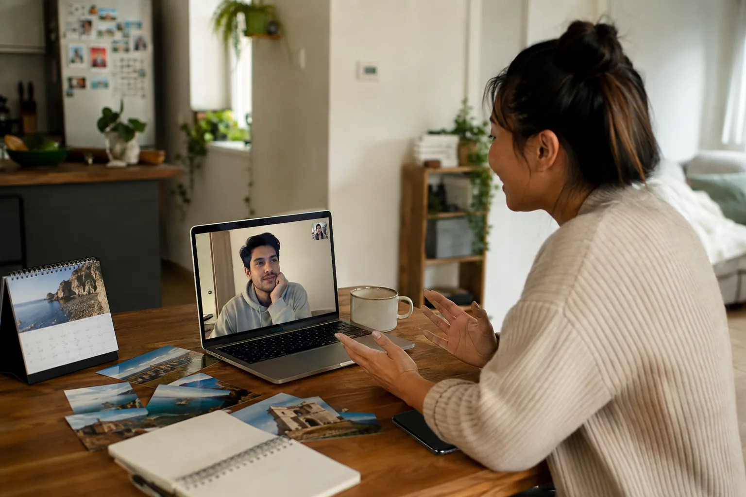 Long-distance partners build trust through an open video conversation with a phone resting face down