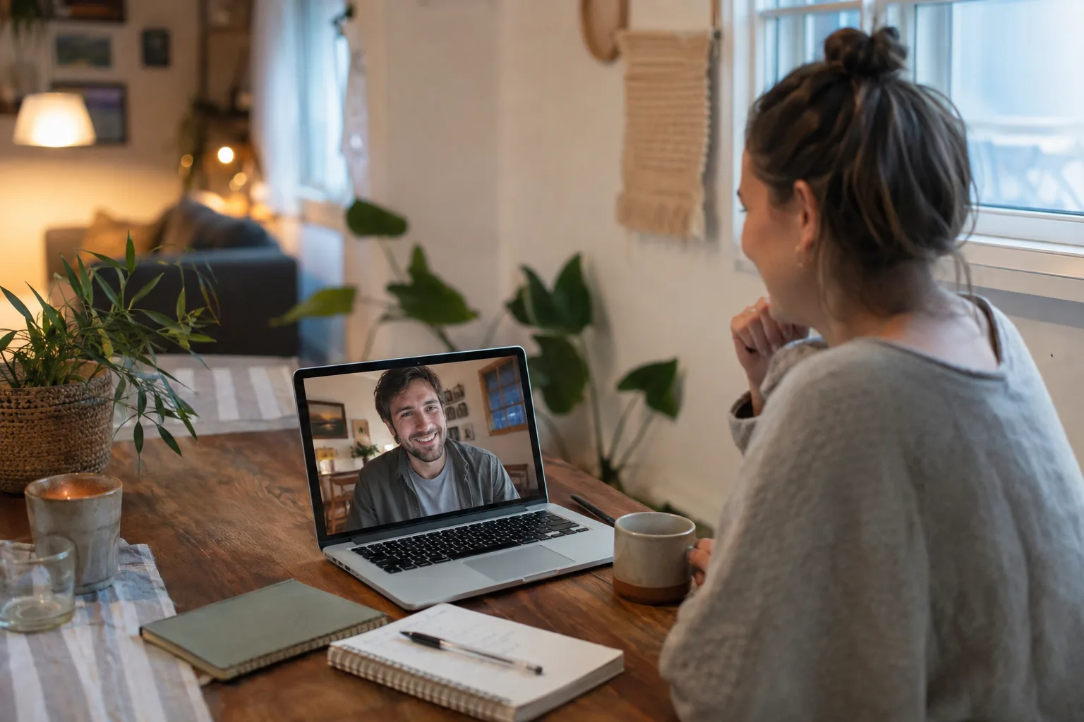 Long-distance partners enjoy a relaxed scheduled video call from their separate homes